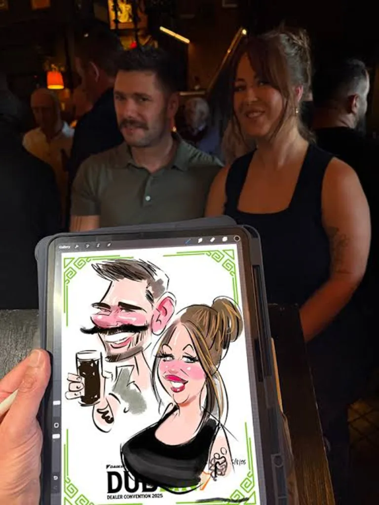 Couple posing behind their digital caricature drawn live at a dealer convention